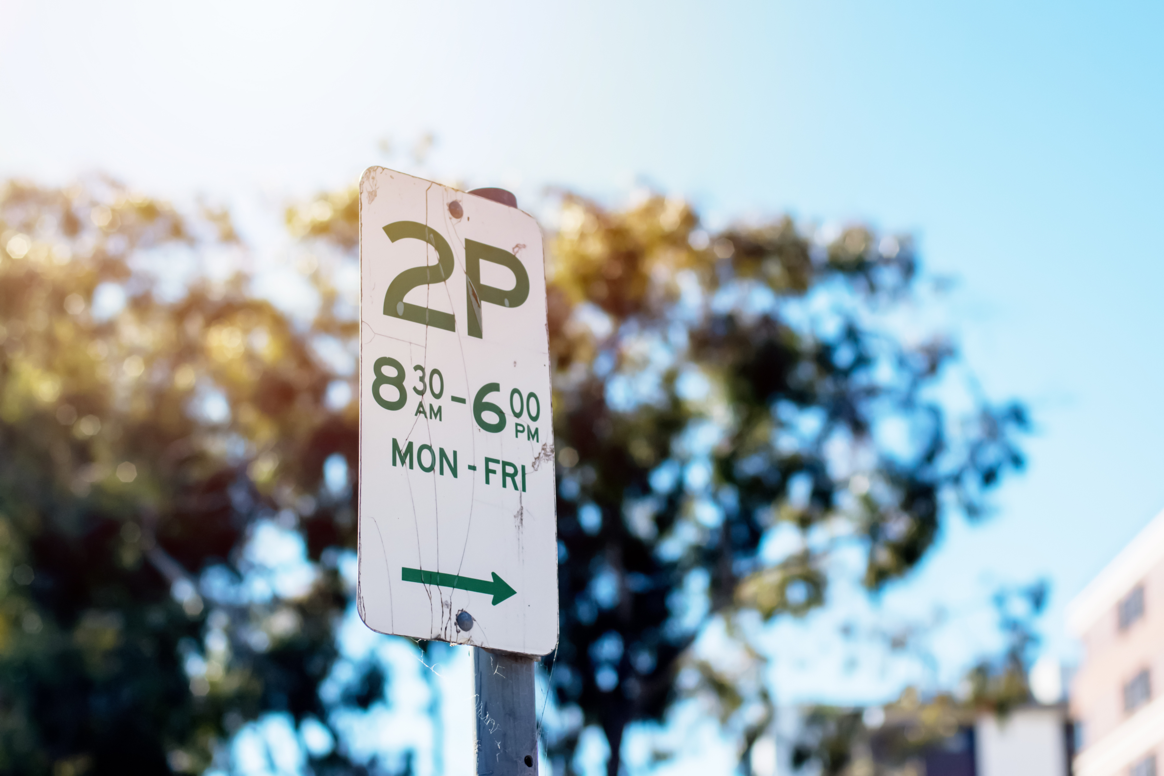 Street Parking Sign With Parking Rules Not To Park For More Than Two Hours 2p On Weekday Mornings In New South Wales, Australia